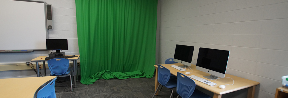 Green Screen and Apple Computers in a corner of the Learning Commons